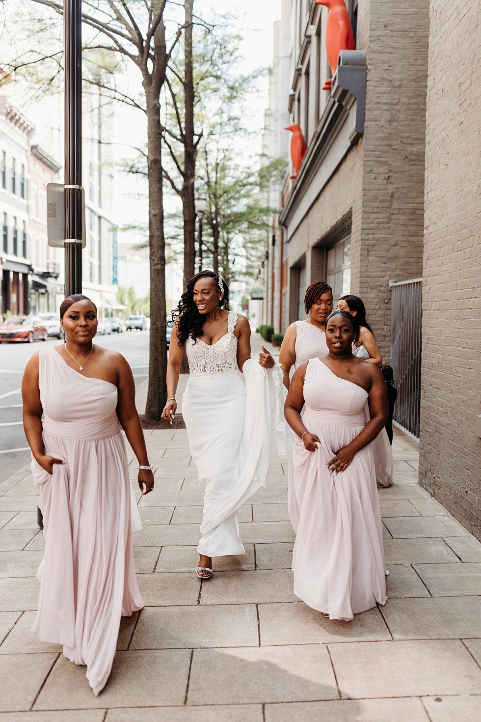  Bride and bridesmaids photos in downtown louisville, Kentucky. Rooftop wedding and reception at 21C Hotel Louisville 