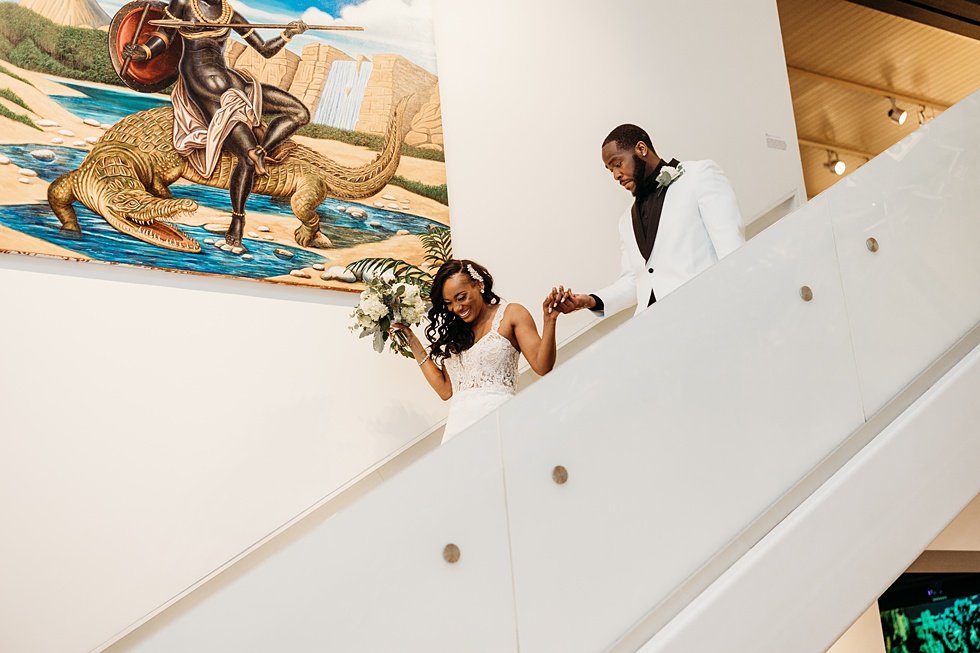  Grand entrence on starrcase at 21C. Wedding reception at 21c Hotel Louisville. Rooftop wedding and reception at 21C Hotel Louisville 