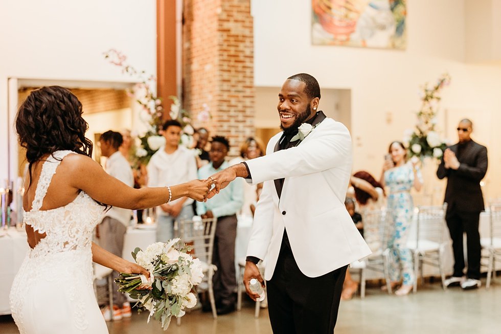  Couple's first dance at 21C. Wedding reception at 21c Hotel Louisville. Rooftop wedding and reception at 21C Hotel Louisville 
