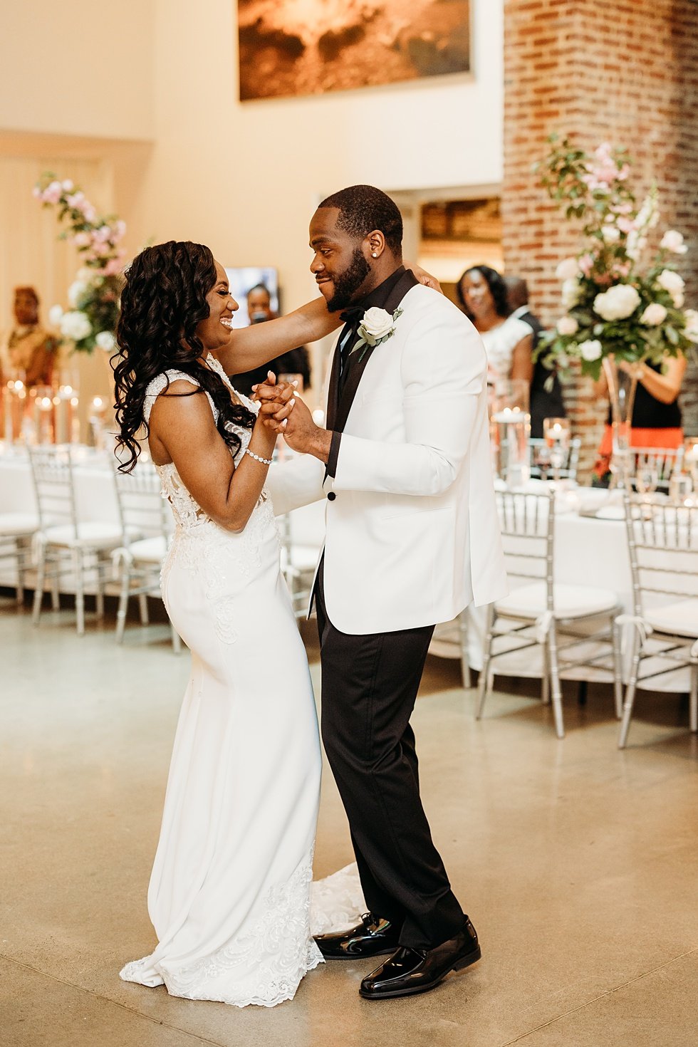  Couple's first dance at 21C. Wedding reception at 21c Hotel Louisville. Rooftop wedding and reception at 21C Hotel Louisville 
