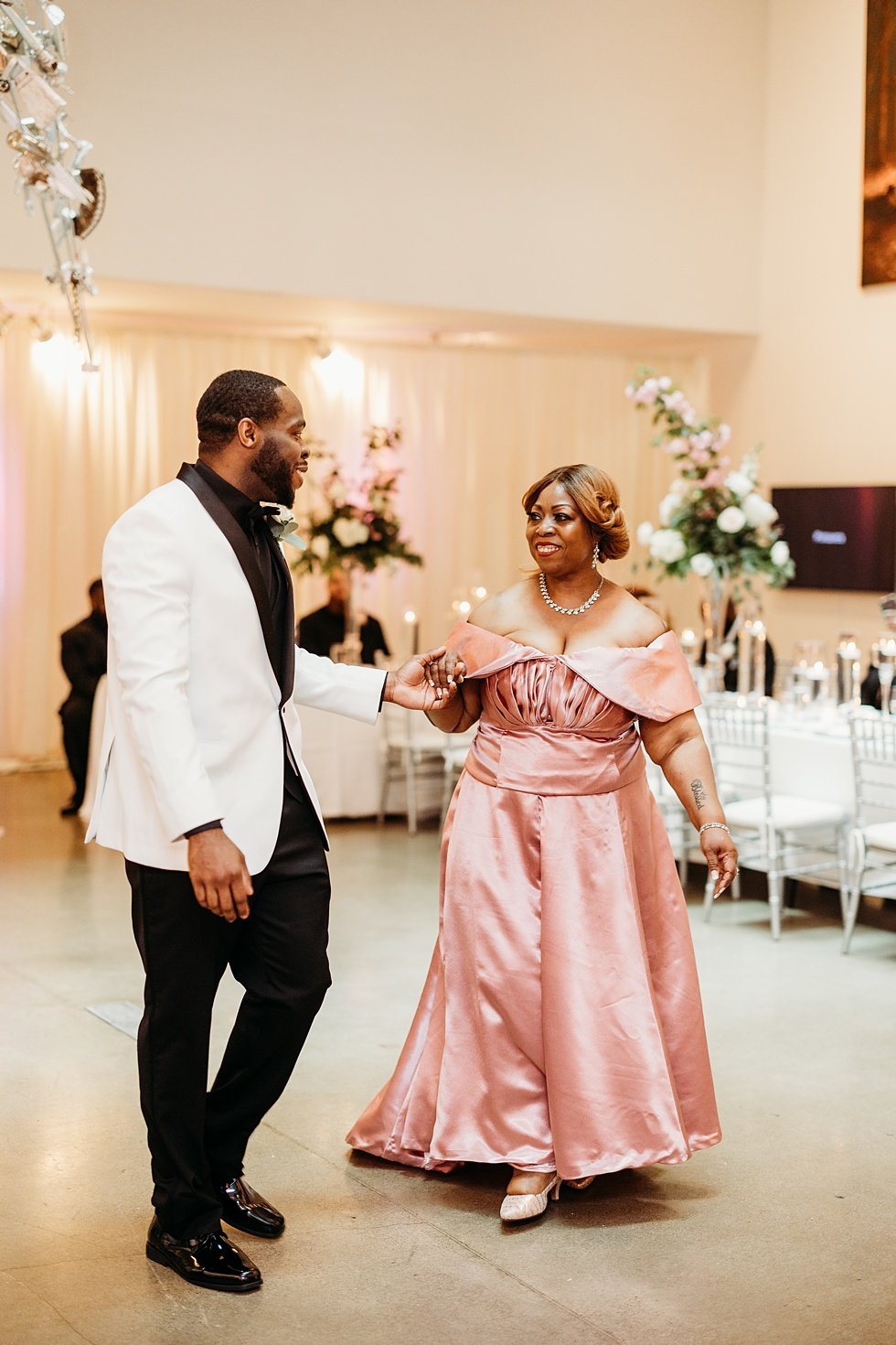  Mother and son dance at 21c. Wedding reception at 21c Hotel Louisville. Rooftop wedding and reception at 21C Hotel Louisville 