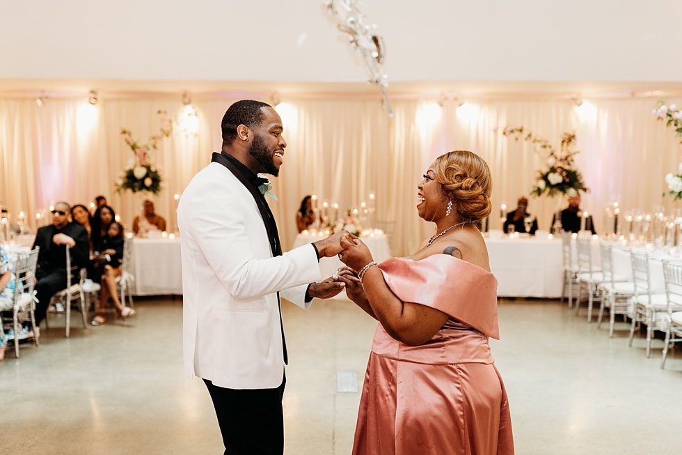  Mother and son dance at 21c. Wedding reception at 21c Hotel Louisville. Rooftop wedding and reception at 21C Hotel Louisville 