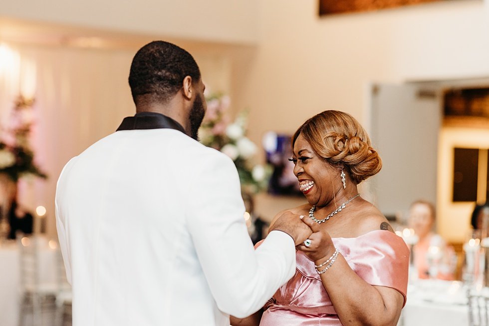  Mother and son dance at 21c. Wedding reception at 21c Hotel Louisville. Rooftop wedding and reception at 21C Hotel Louisville 