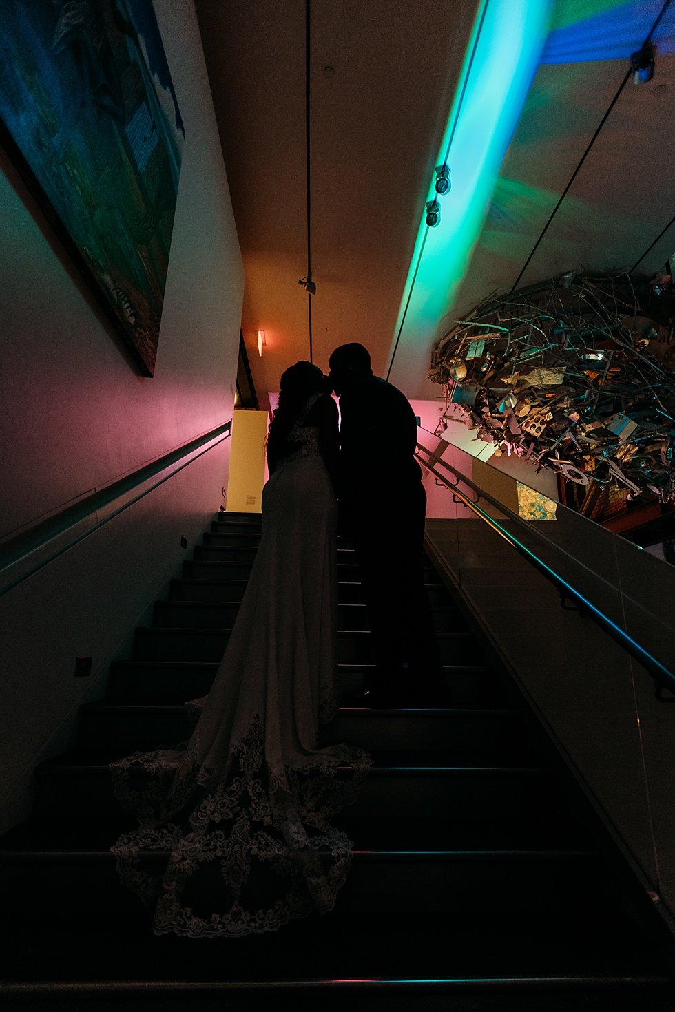  Couple's silhouette on staricase at 21c. Wedding reception at 21c Hotel Louisville. Rooftop wedding and reception at 21C Hotel Louisville 