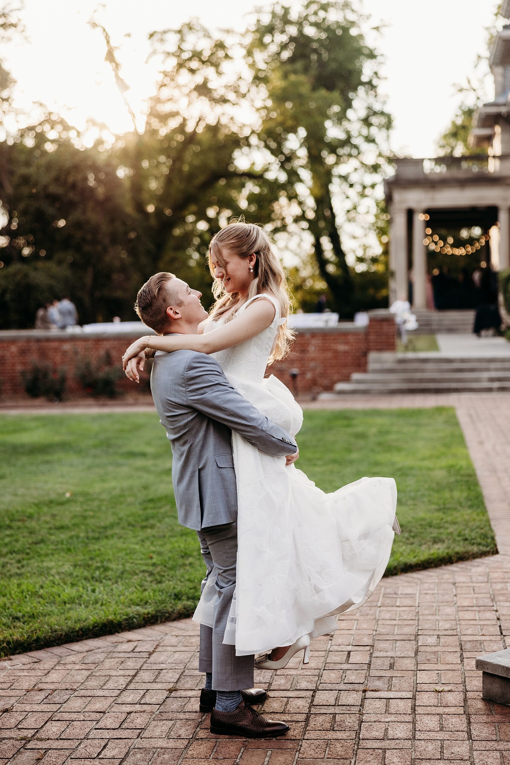 Bride and groom outside Gardencourt for sunset portraits