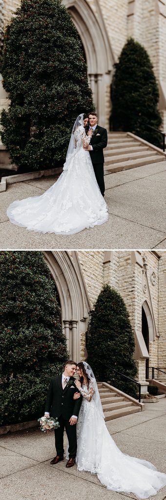 Bride and groom pose together outside the stone church after their wedding.