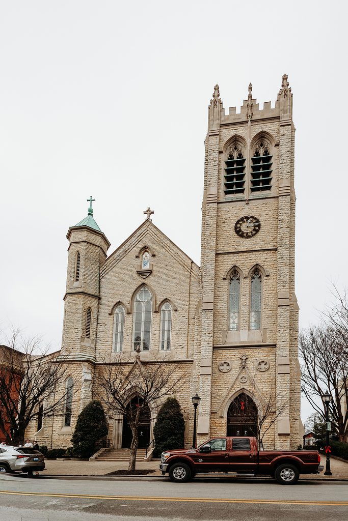 St. Louis Bertrand Catholic Church Louisville, KY wedding venue exterior with stone facade and bell tower.