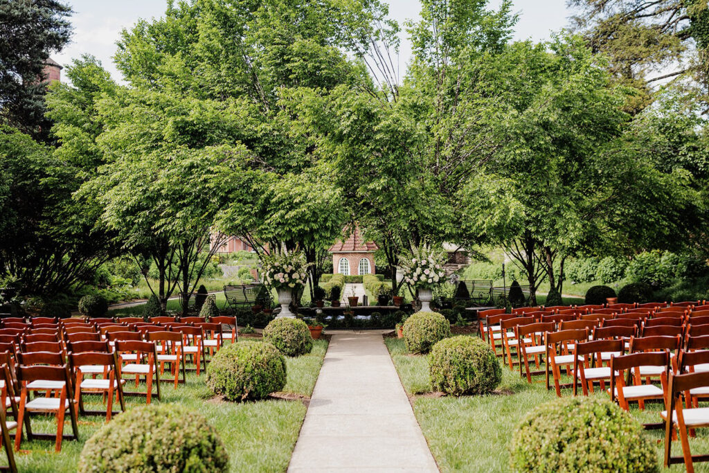 Castle & Key Sunken Garden ceremony setup with rows of chairs and manicured landscaping.