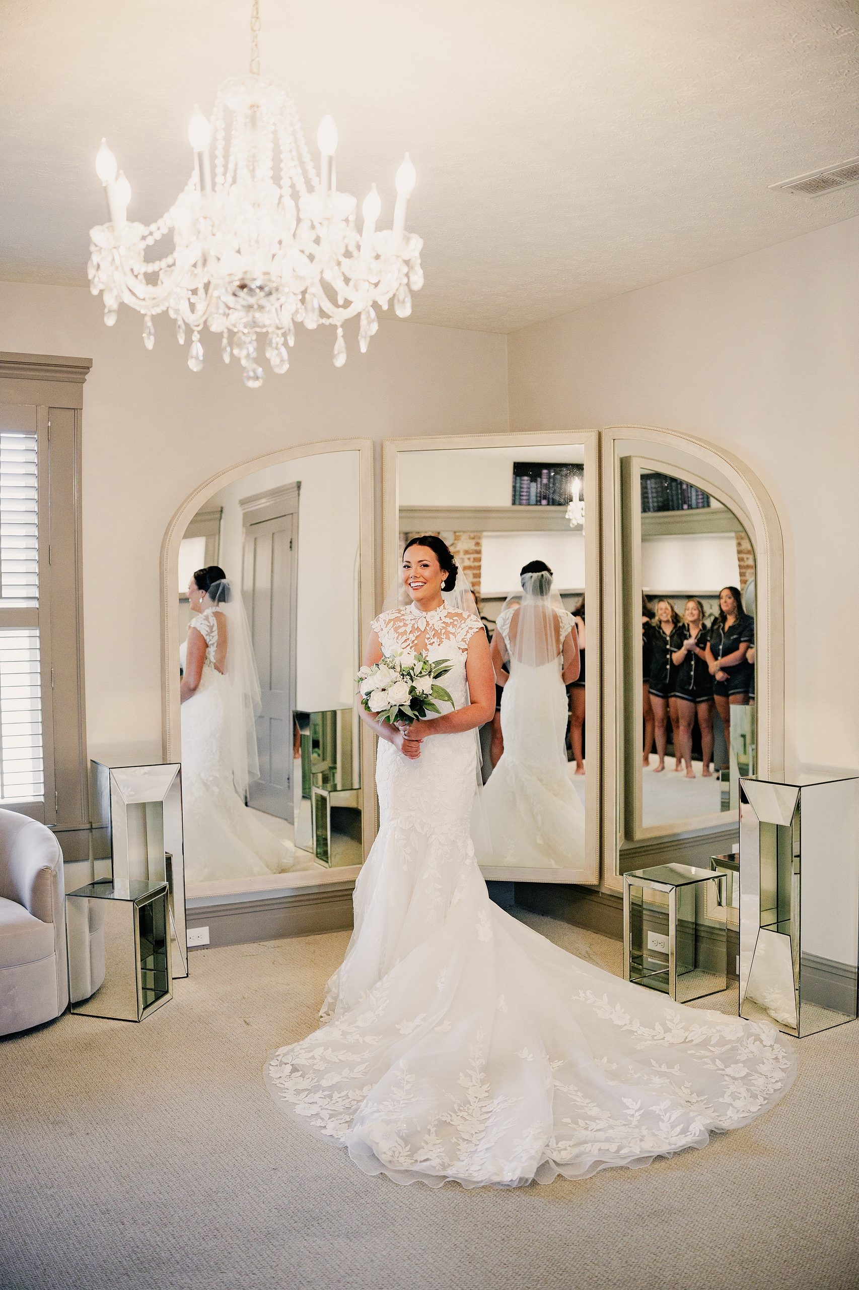 Bride holding her bouquet for a bridal portrait inside Bradshaw-Duncan House's bridal suite.