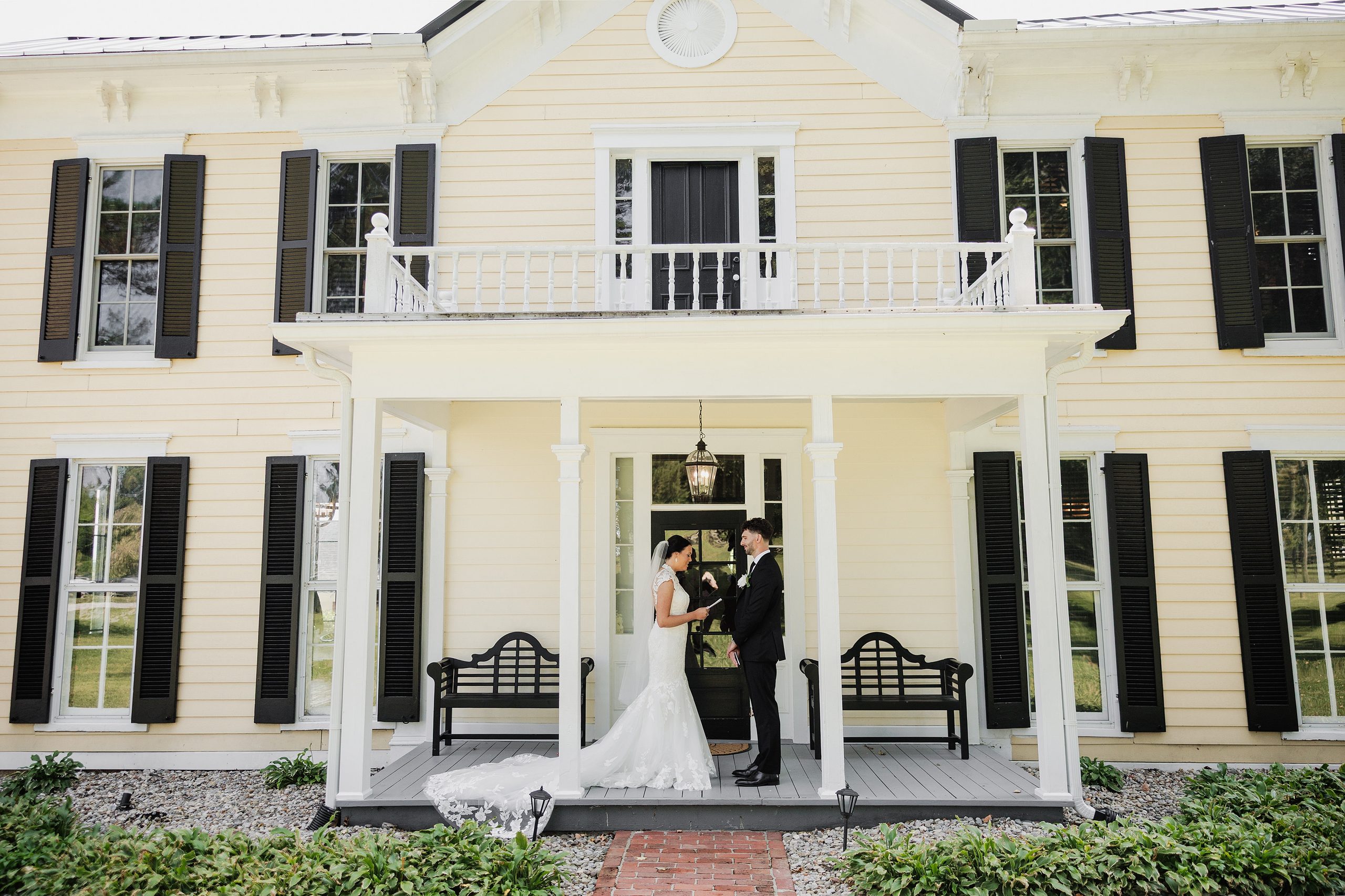 Bride and groom share their wedding first look on the porch of Bradshaw-Duncan house in Crestwood, KY.