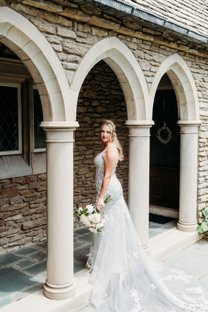 Bridal portrait in front of stone columns at Duncan Memorial