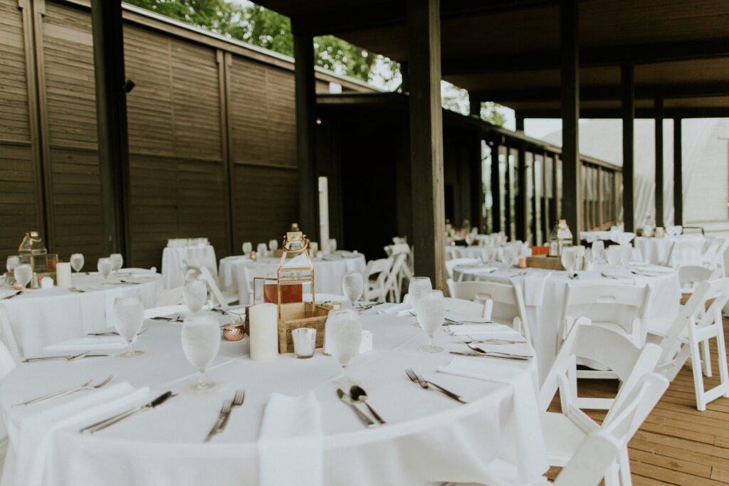 Yew Dell’s Peyton Samuel Head Trust Pavilion reception space with round tables, white linens, and elegant wedding table settings ready for guests.