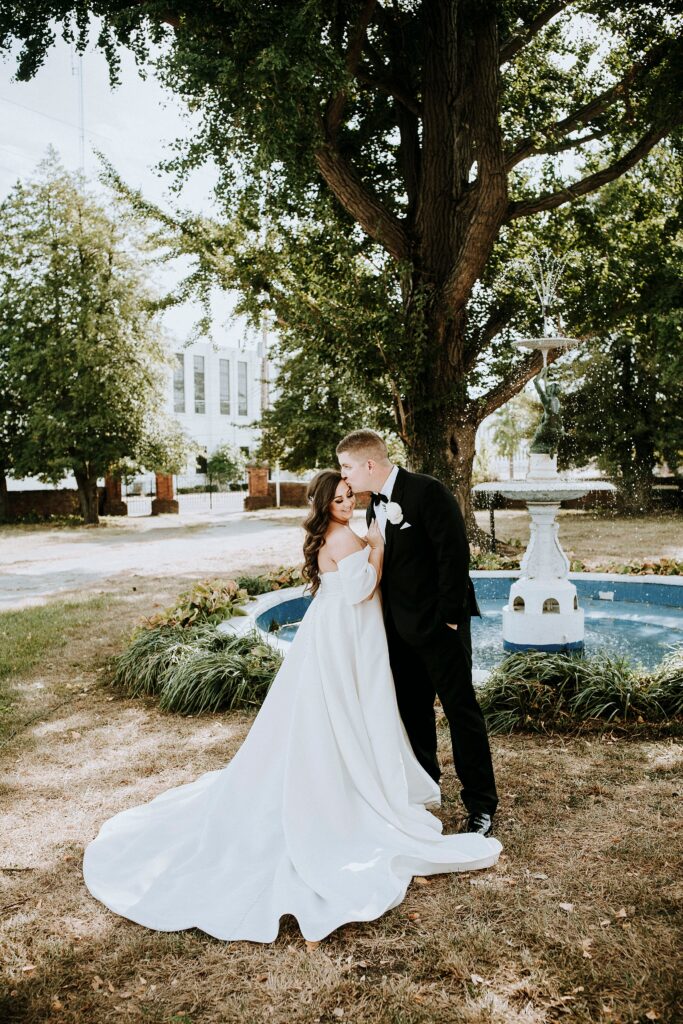 Couple wedding portrait by the fountain.