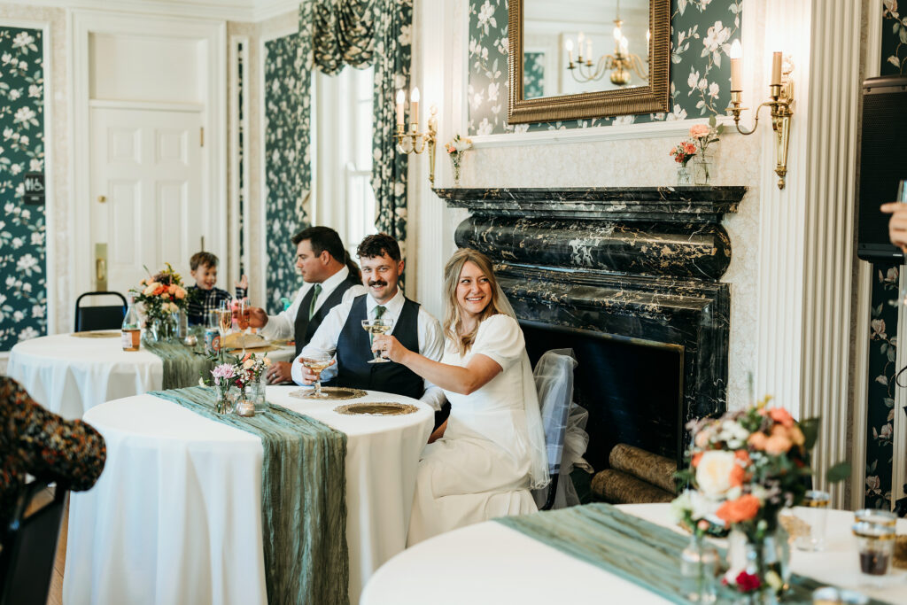Bride & groom toast at their small wedding reception in Louisville, KY