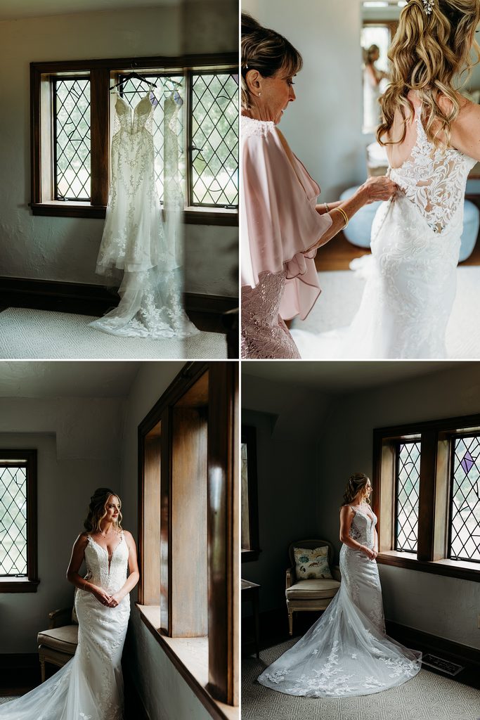 Bride getting ready in a lace wedding dress beside leaded glass windows before an intimate chapel wedding.