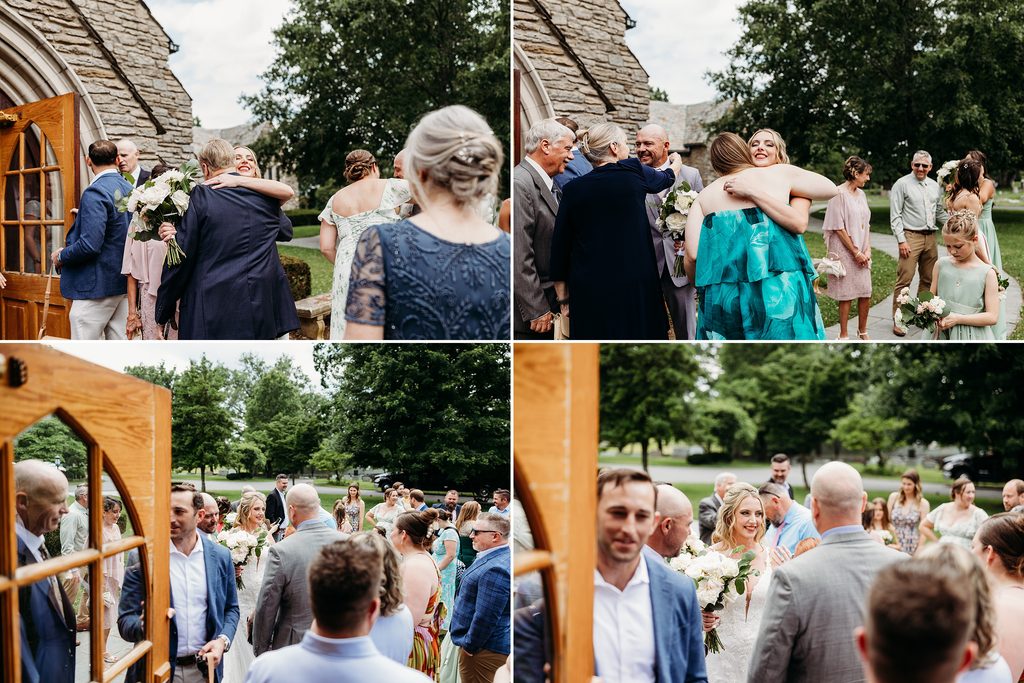 Wedding guests hug and congratulate the bride and groom outside the chapel after the ceremony.