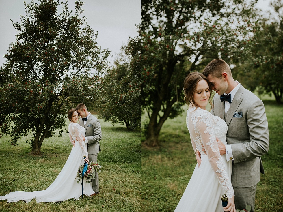 Bride and groom pose beneath the trees during their Farmington wedding portraits.